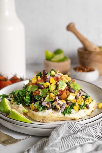 Filled with cats uploaded with sauce, black beans, corn & avocado