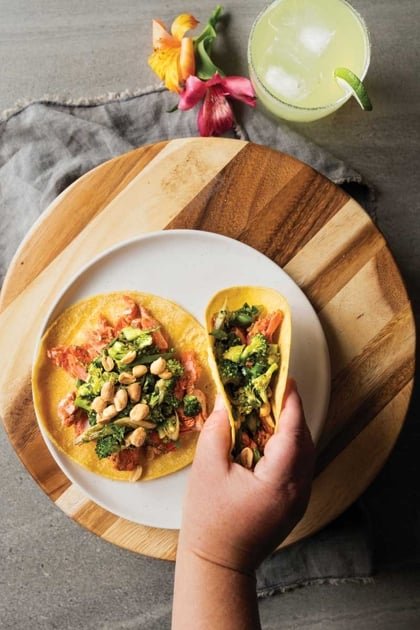 Kung pao salmon tacos with slaw broccoli